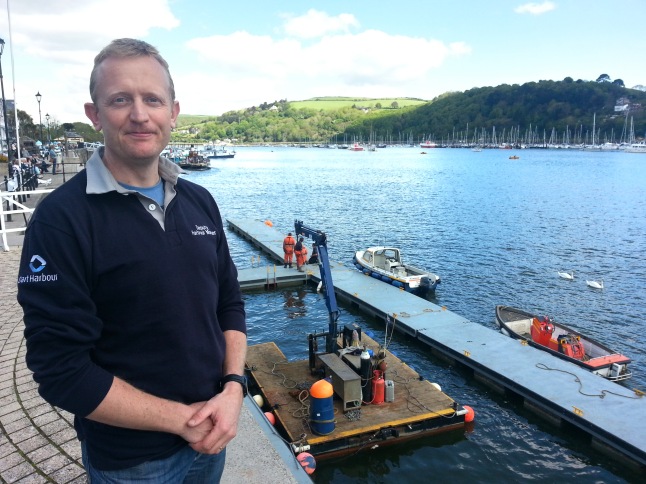 Nick Clarance stands proudly as his team of river officers installs the Seasonal Yacht Club Pontoon off Dartmouth’s South Embankment.